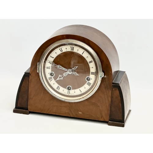 207 - A vintage Art Deco mantle clock by Enfield. With pendulum. 29x12x22cm