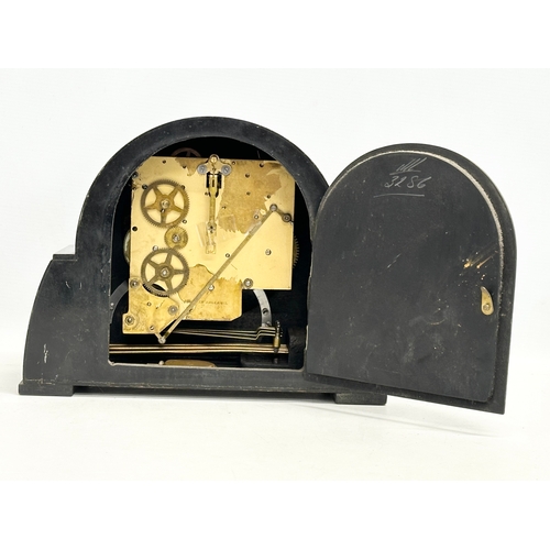 207 - A vintage Art Deco mantle clock by Enfield. With pendulum. 29x12x22cm