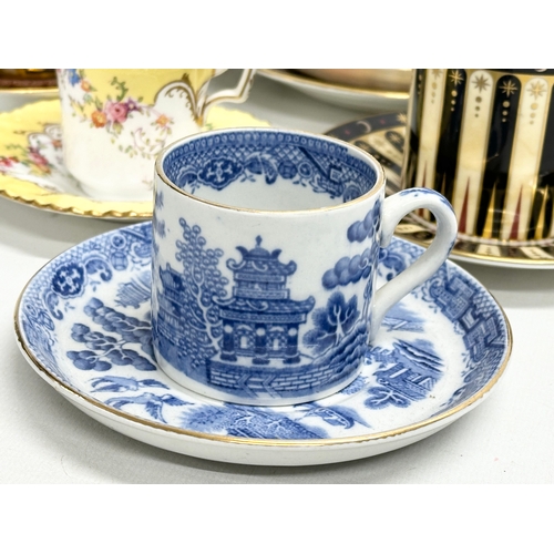 231 - A collection of cups and saucers. Royal Worcester ‘Celebration’ 2001 Collection 250th Anniversary. 2... 