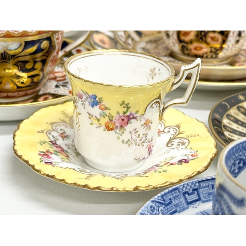 231 - A collection of cups and saucers. Royal Worcester ‘Celebration’ 2001 Collection 250th Anniversary. 2... 