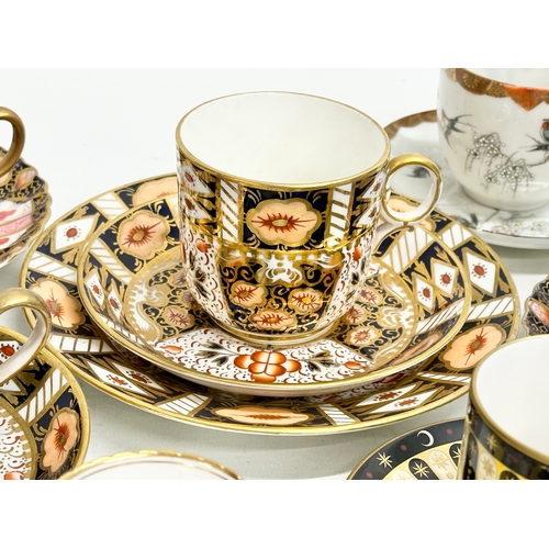 231 - A collection of cups and saucers. Royal Worcester ‘Celebration’ 2001 Collection 250th Anniversary. 2... 