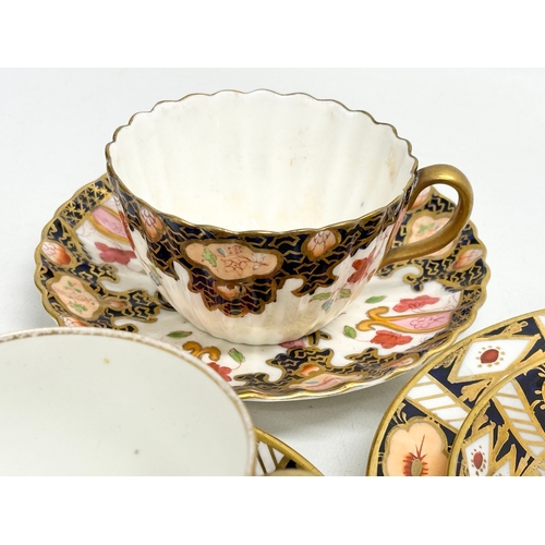 231 - A collection of cups and saucers. Royal Worcester ‘Celebration’ 2001 Collection 250th Anniversary. 2... 