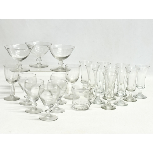 234 - A collection of early 20th century drinking glasses. 10 1920’s French liquor/sherry glasses 11cm. 3 ... 