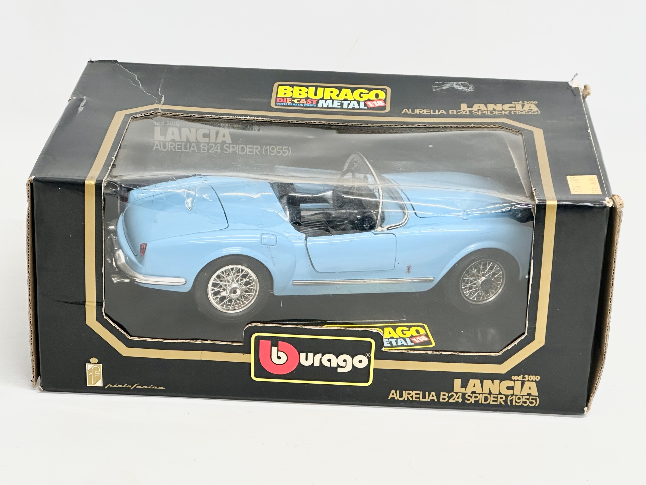 A Burago Lancia Aurelia B24 Spider (1955) model car with box