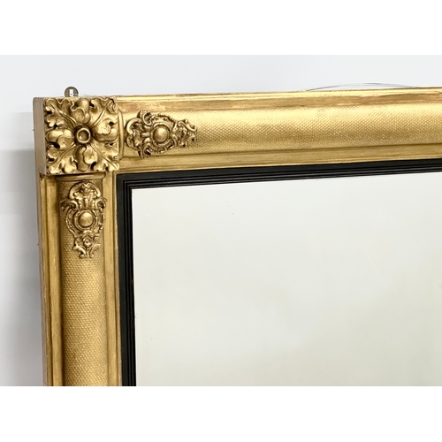 42 - A late 19th century William IV style gilt framed over-mantle mirror. Carver & Gilder. Circa 1880. 10... 