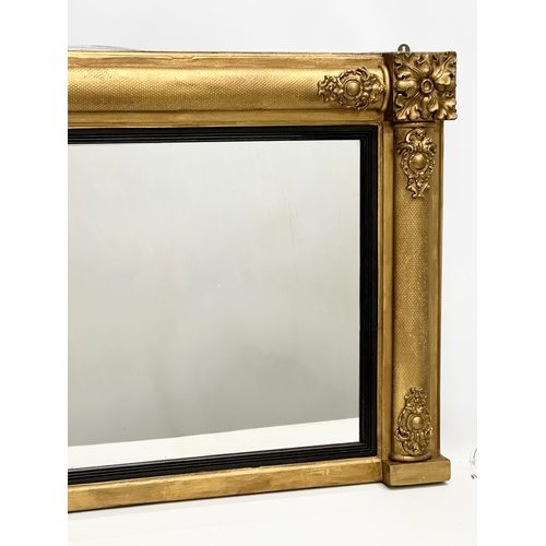 42 - A late 19th century William IV style gilt framed over-mantle mirror. Carver & Gilder. Circa 1880. 10... 