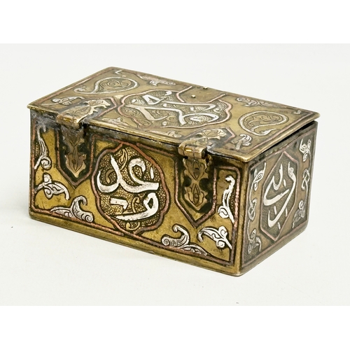 43 - A 19th century Cairo Ware silver and copper inlaid brass trinket box. 9.5x6x4.5cm