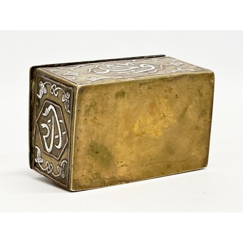 43 - A 19th century Cairo Ware silver and copper inlaid brass trinket box. 9.5x6x4.5cm