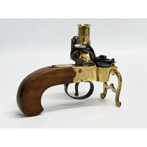 211 - A good quality brass flintlock Tinder Pistol. Made in Italy.