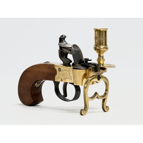 211 - A good quality brass flintlock Tinder Pistol. Made in Italy.