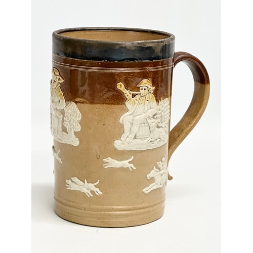 83 - A tall late 19th century silver rimmed Doulton Lambeth stoneware tankard 19cm, with an early 20th ce... 