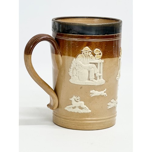 83 - A tall late 19th century silver rimmed Doulton Lambeth stoneware tankard 19cm, with an early 20th ce... 