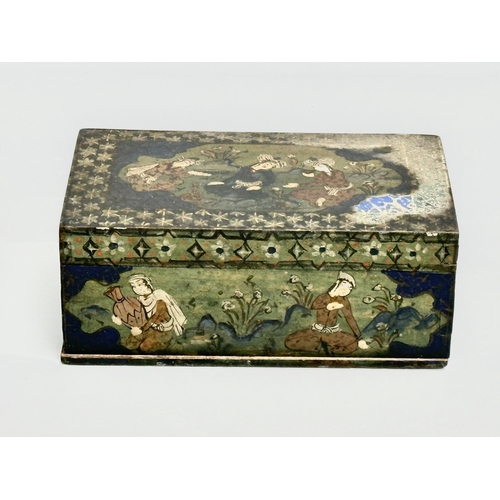 214 - An early 20th century Indian hand painted wooden tabletop storage box. 17.5x10.5x6.5cm