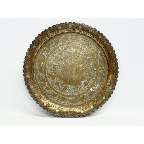 215 - 2 late 19th century Middle Eastern brass trays. 32x33cm