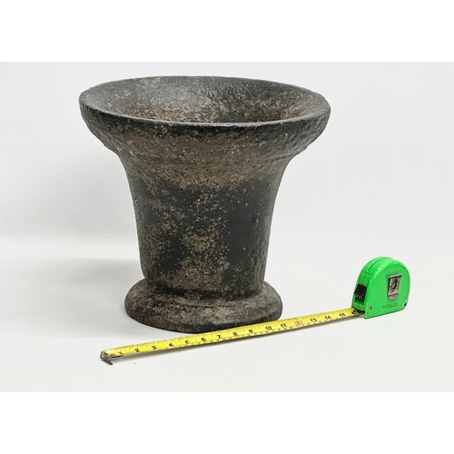 227 - A large 19th century cast iron mortar. 34x30cm