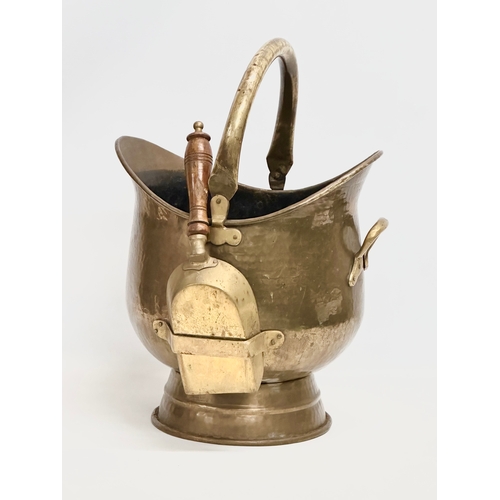 228 - A large early 20th century brass coal scuttle. 32x37x52cm