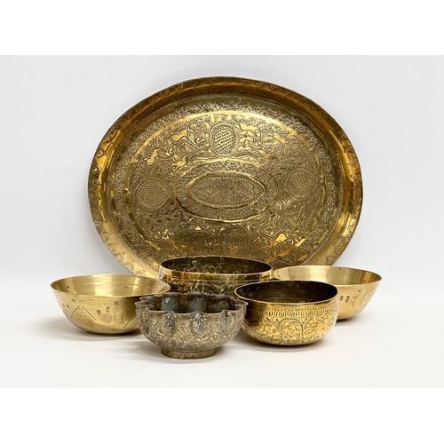 237 - 19th century Middle Eastern brass bowls and tray. Tray measures 29.5x24.5cm. Bowls 12cm, 11.5cm, 10c... 