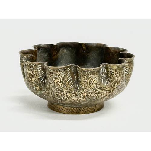 237 - 19th century Middle Eastern brass bowls and tray. Tray measures 29.5x24.5cm. Bowls 12cm, 11.5cm, 10c... 