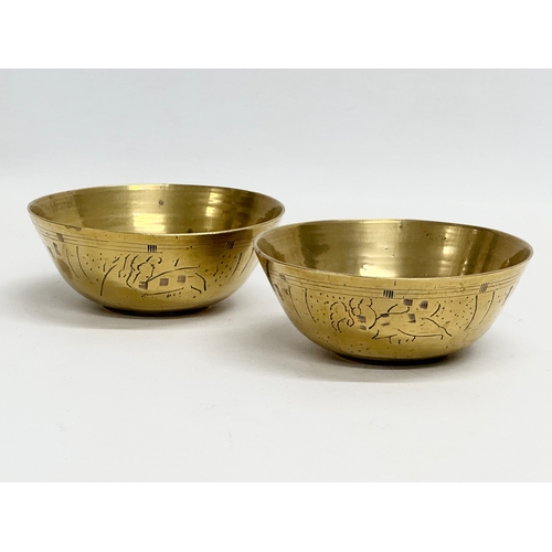 237 - 19th century Middle Eastern brass bowls and tray. Tray measures 29.5x24.5cm. Bowls 12cm, 11.5cm, 10c... 