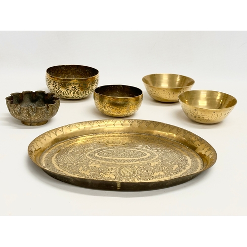 237 - 19th century Middle Eastern brass bowls and tray. Tray measures 29.5x24.5cm. Bowls 12cm, 11.5cm, 10c... 