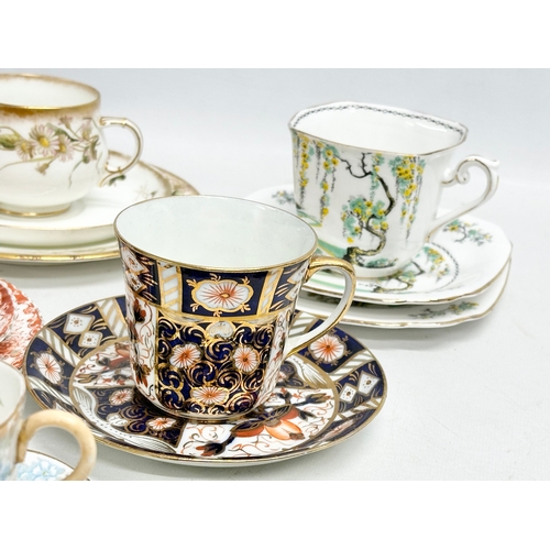 240 - A collection of cups and saucers. A Birks Rawlings & Co Imari cup and saucer. A Doulton Burslem ‘Kat... 