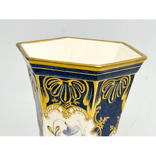 244 - A hand painted porcelain vase. 13x12x24cm