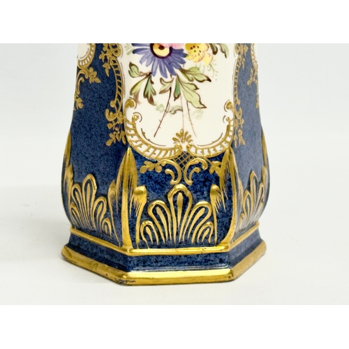 244 - A hand painted porcelain vase. 13x12x24cm