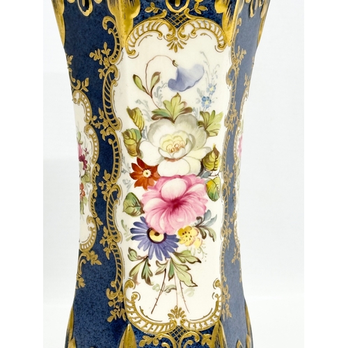 244 - A hand painted porcelain vase. 13x12x24cm