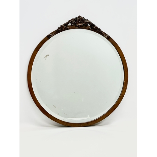 245 - An early 20th century mahogany framed bevelled mirror. 49x53.5cm