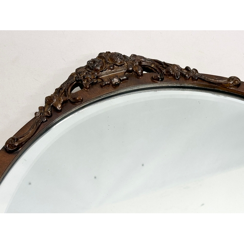 245 - An early 20th century mahogany framed bevelled mirror. 49x53.5cm