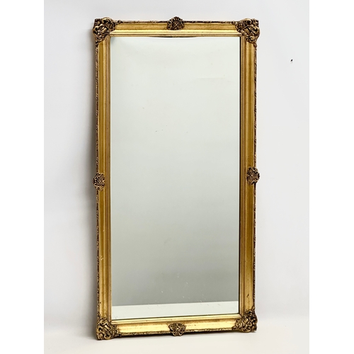 170 - A good quality vintage ornate gilt framed mirror. 46x86cm