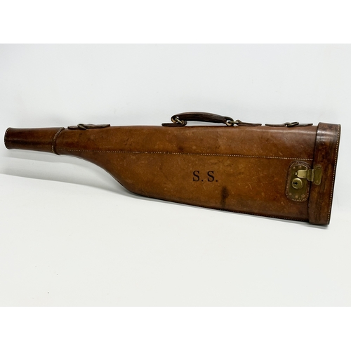 167A - A vintage leather gun case. 80.5cm