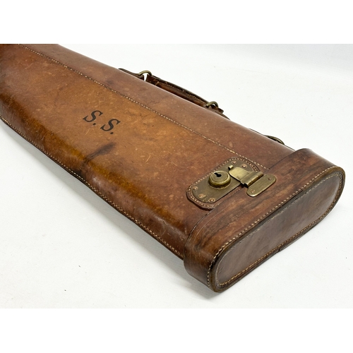 167A - A vintage leather gun case. 80.5cm