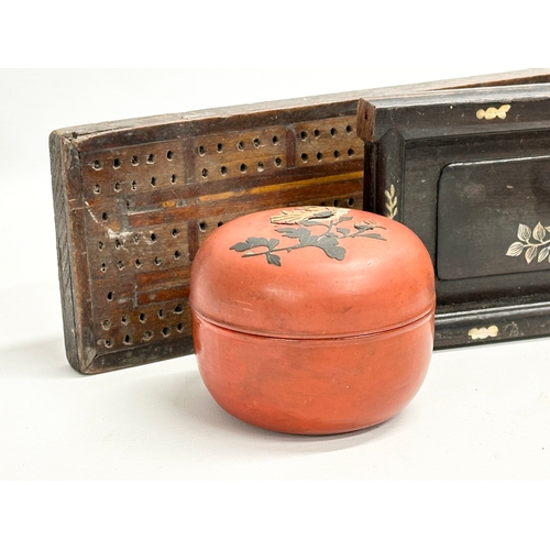 253 - A sundry lot. A 1930’s Bakelite powder box. An early 20th century Japanese red lacquered box. A Libe... 