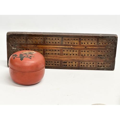 253 - A sundry lot. A 1930’s Bakelite powder box. An early 20th century Japanese red lacquered box. A Libe... 