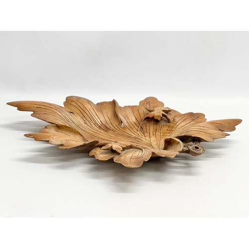 65 - A large early 20th century carved Butternut centrepiece bowl. 35x50cm