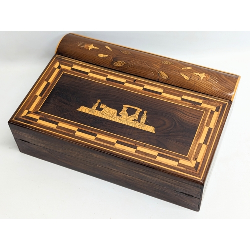 260 - An early 20th century inlaid padauk writing box. 42x48.5x13cm