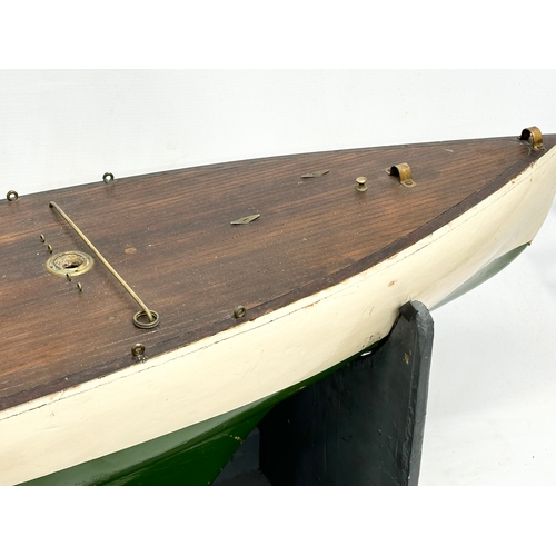 55A - A large good quality vintage model yacht on stand. Yacht measures 135x29x41.5cm