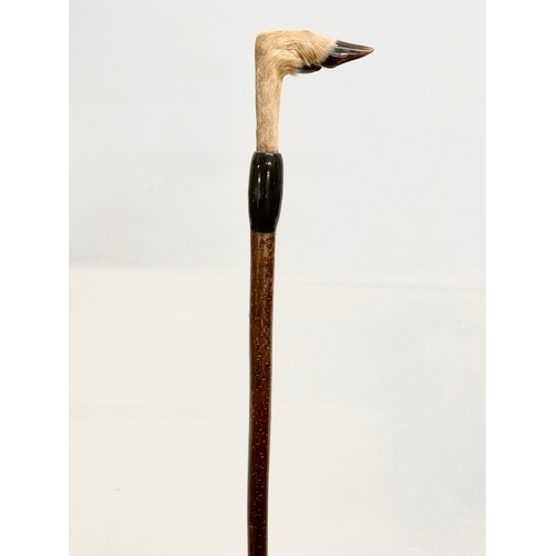 366L - A large vintage hiking stick with taxidermy deer foot. 143cm