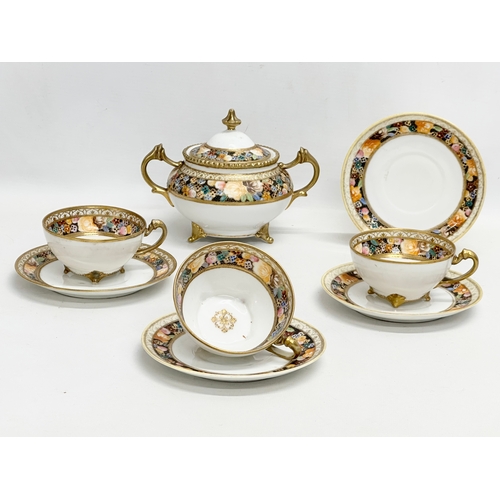 366N - An early 20th century Japanese hand painted porcelain part tea service by Noritake.