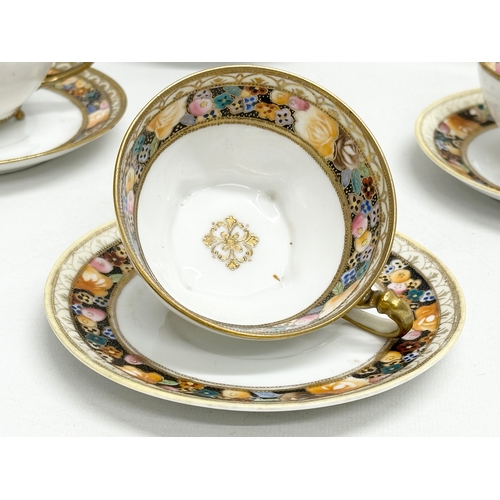 366N - An early 20th century Japanese hand painted porcelain part tea service by Noritake.