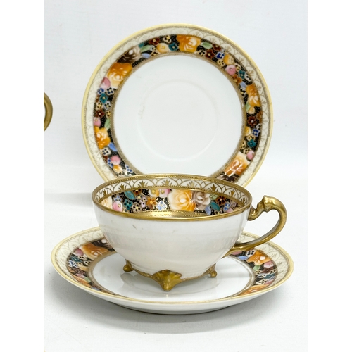 366N - An early 20th century Japanese hand painted porcelain part tea service by Noritake.