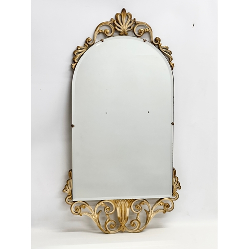 366R - A vintage ornate gilt framed bevelled mirror. 45x84cm