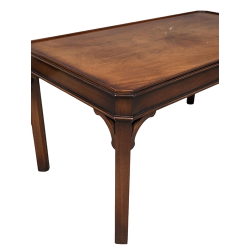 1025 - A mahogany coffee table by makers Bevan Funnell 107cm x 57cm x 54.5cm