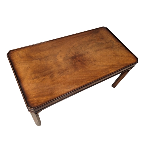 1025 - A mahogany coffee table by makers Bevan Funnell 107cm x 57cm x 54.5cm