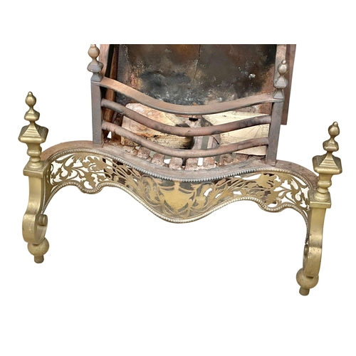 181 - A large early 20th century George III style brass and cast iron fire grate. 74x44x77cm