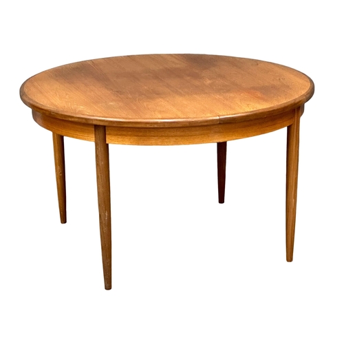 885 - A G-Plan Fresco Mid Century teak extending dining table. Open 168x123x72cm. Closed 123xx72cm.