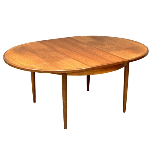 885 - A G-Plan Fresco Mid Century teak extending dining table. Open 168x123x72cm. Closed 123xx72cm.