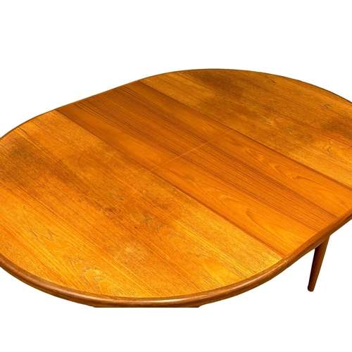 885 - A G-Plan Fresco Mid Century teak extending dining table. Open 168x123x72cm. Closed 123xx72cm.