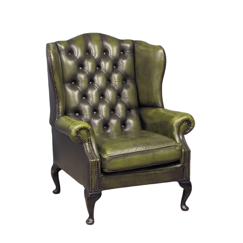 887 - A deep button leather club armchair.  83x80x103cm